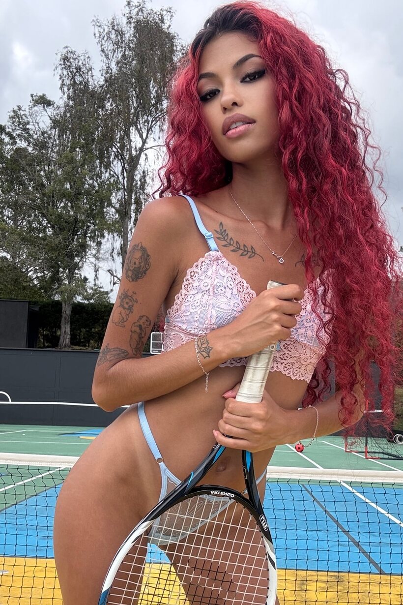 Image 11/20: Redhead girl flaunts her natural tits