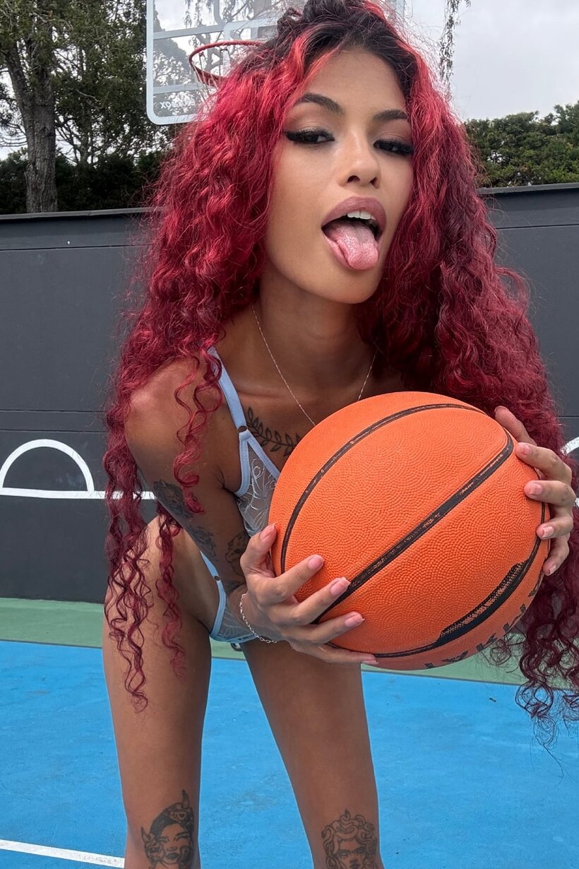 Photo 16 — Redhead girl flaunts her natural tits