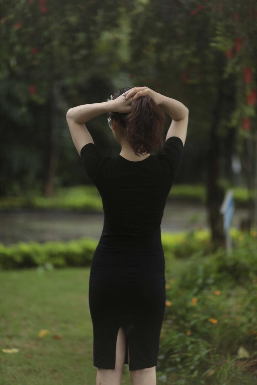 Cute girl gets naked in the garden (shot 9)