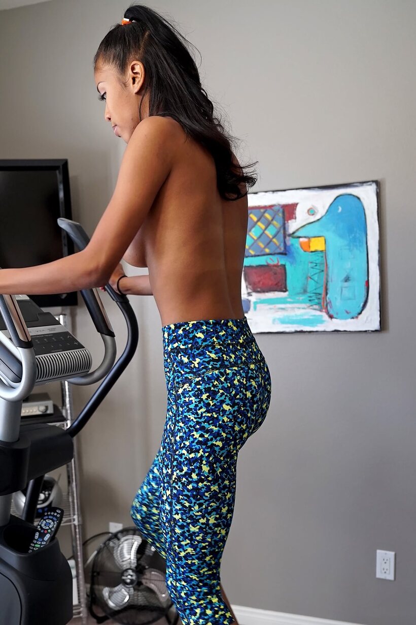 Ebony Nia Nacci poses with her natural tits on display in yoga pants (shot 14)