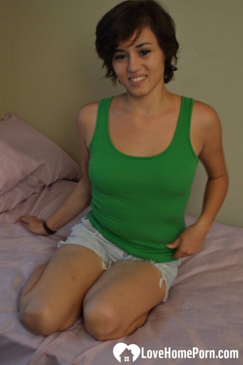Amateur pic 1 from the set «Amateur brunette displays tanned tits while dildoing her shaved cunt»