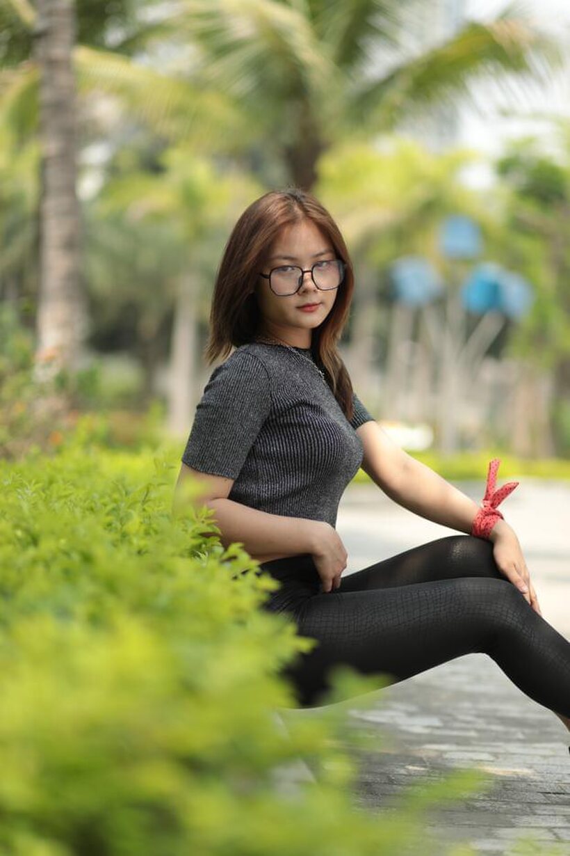 Image 13/21: Natalia strikes a sexy public pose in her glasses and outfit