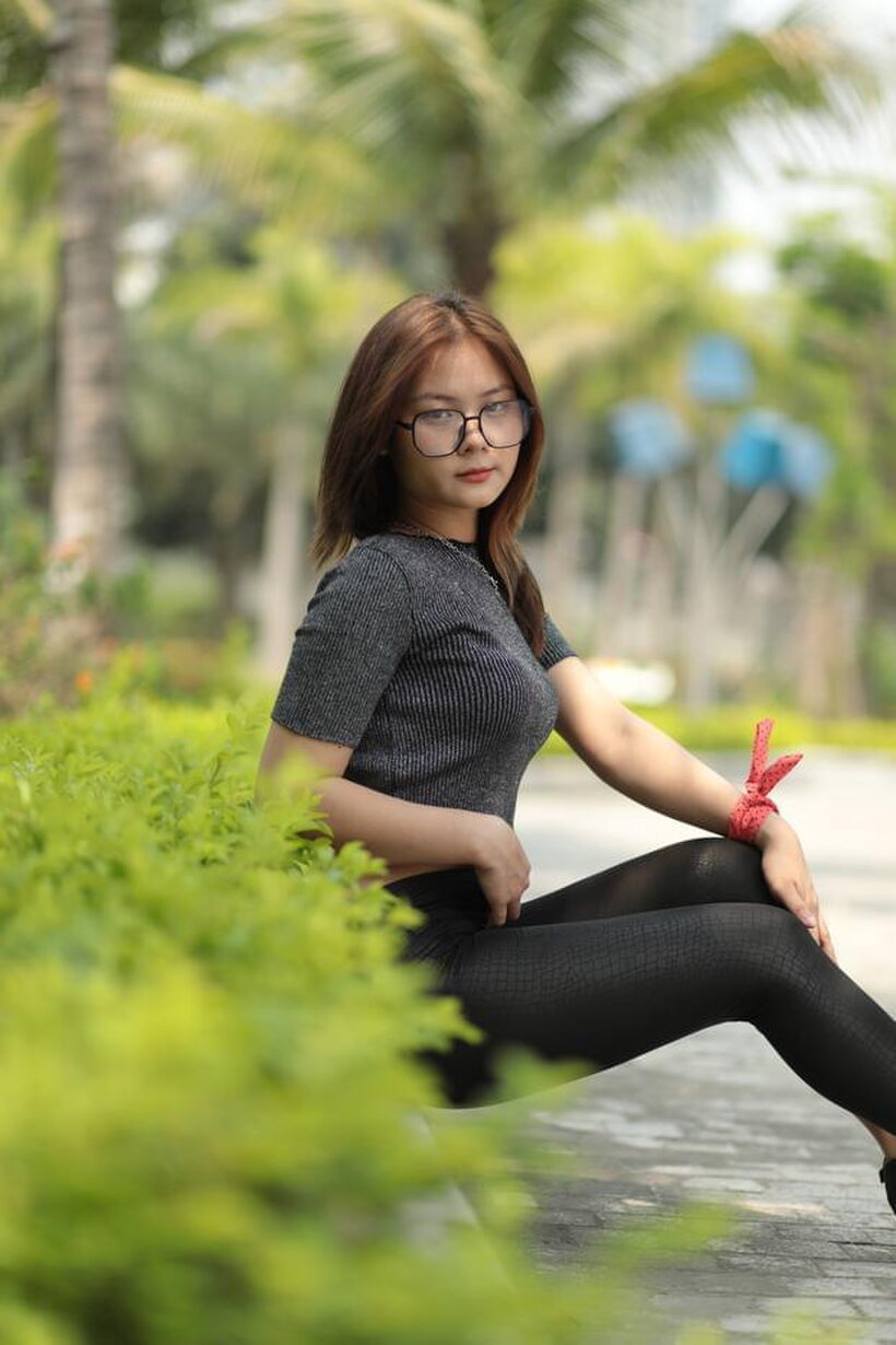 Photo 14 — Natalia strikes a sexy public pose in her glasses and outfit