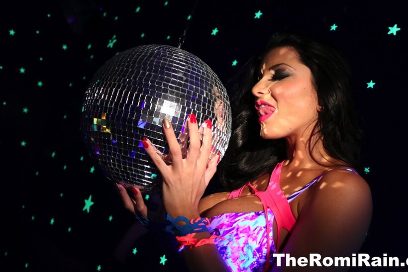 Photo 1 — Pornstar Romi Rain shows off her big tits and pussy in high heels