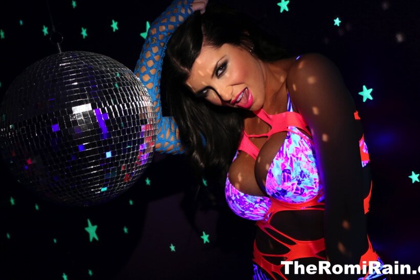 Photo 3 — Pornstar Romi Rain shows off her big tits and pussy in high heels