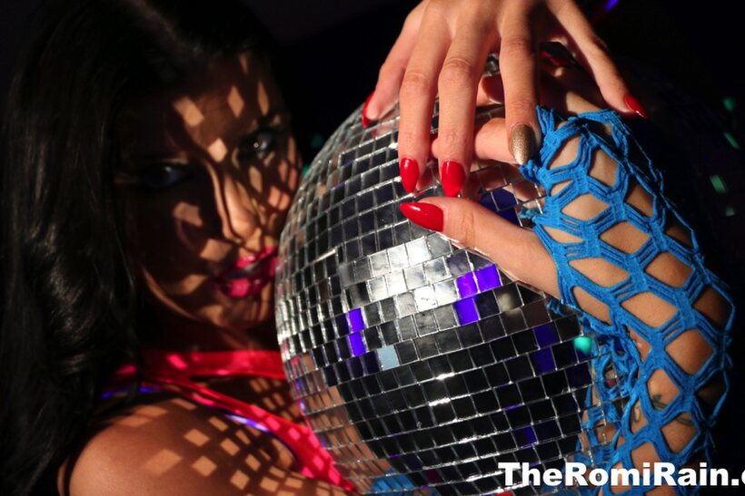 Pornstar Romi Rain shows off her big tits and pussy in high heels (shot 8)