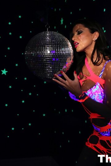 Pornstar Romi Rain shows off her big tits and pussy in high heels
