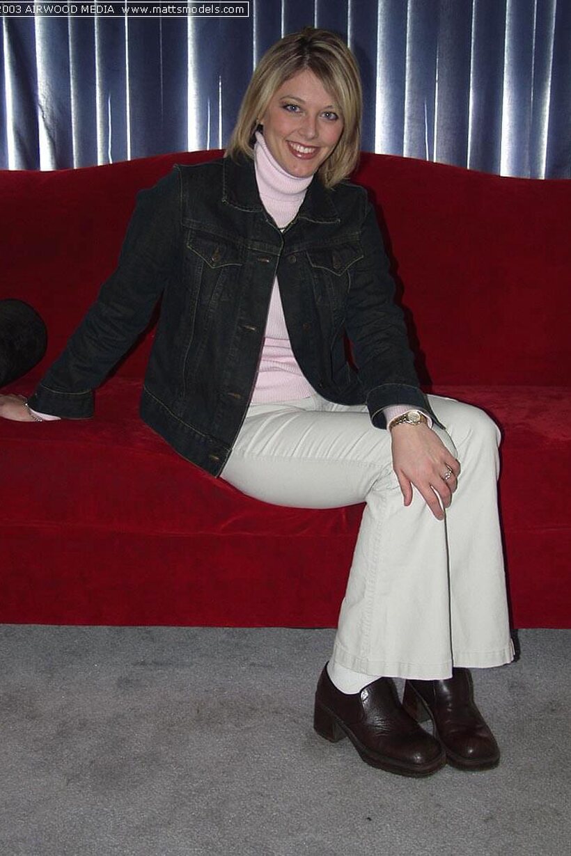 Photo 1 — Blonde girl shows her nipples and feet while undressing