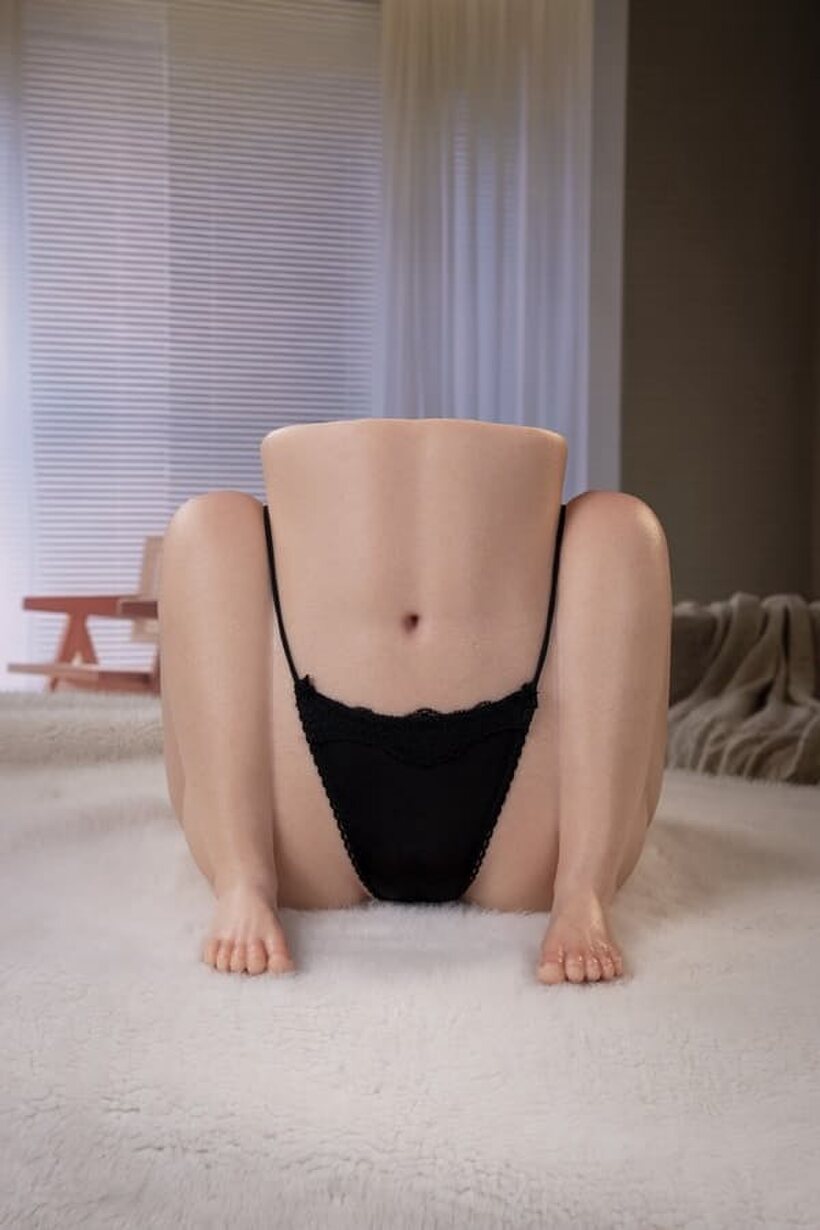 Image 11/21: Black underwear comes off to reveal the sex doll’s bald pussy