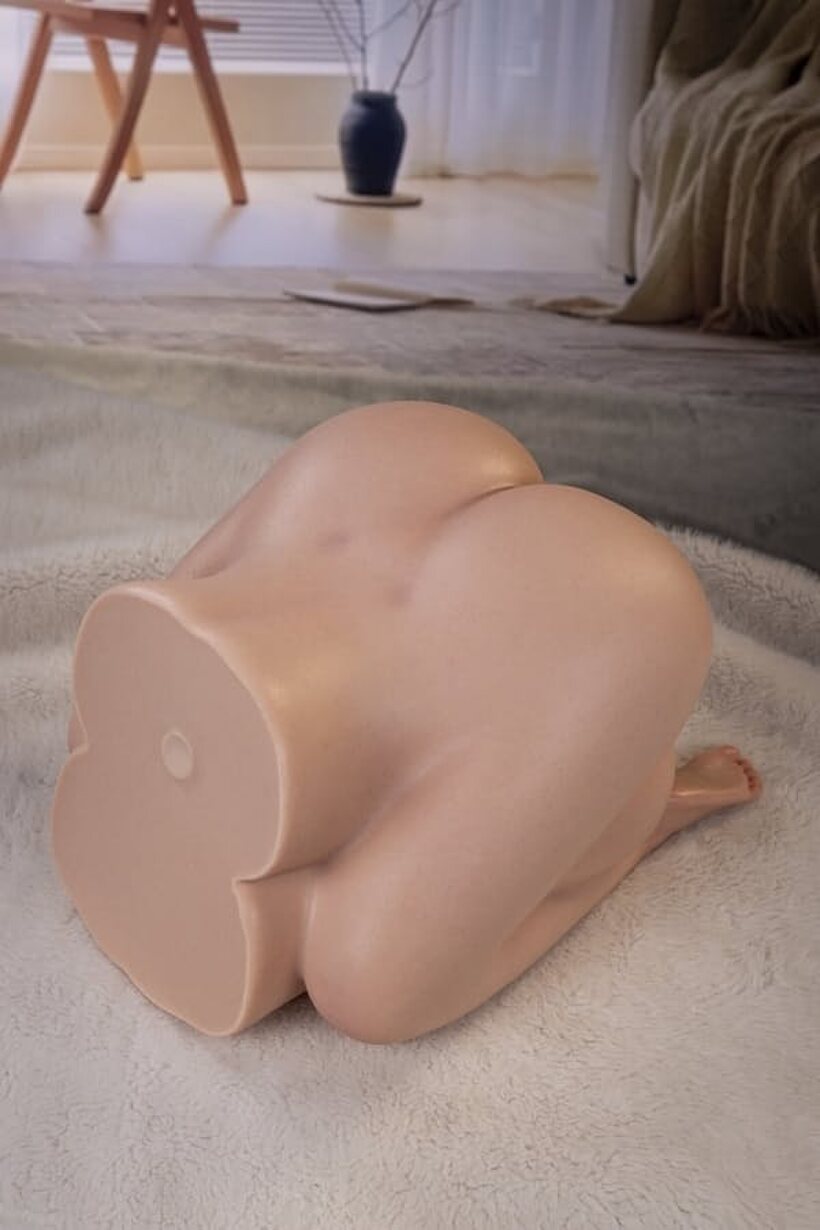 Black underwear comes off to reveal the sex doll’s bald pussy (shot 16)