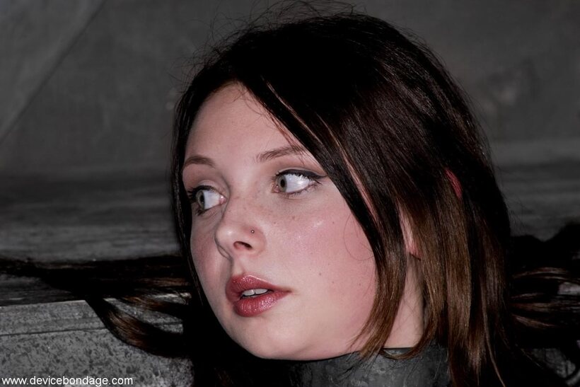 Clothed Sara Scott tied up in bdsm lingerie (shot 11)