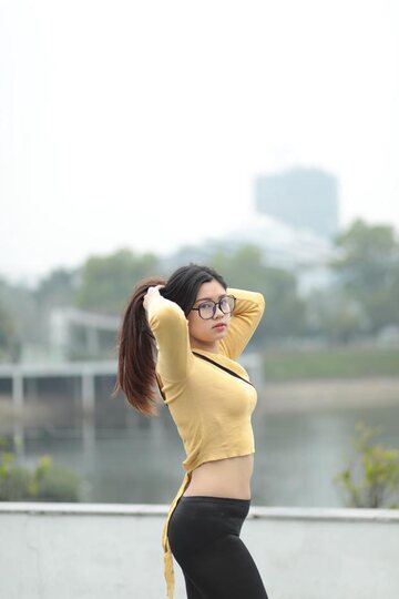 Clothed girl gets naked outdoors