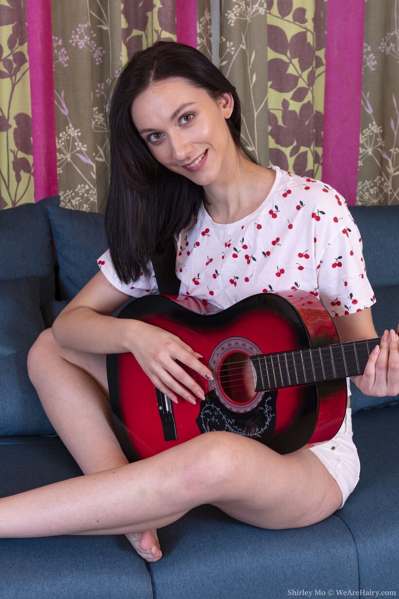 Photo 1 — Shirley Mo undresses, opens her legs and reveals her hairy cunt