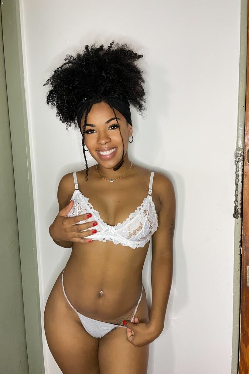 Photo 1 — Curvy ebony model poses in lingerie and a bikini, showing ass