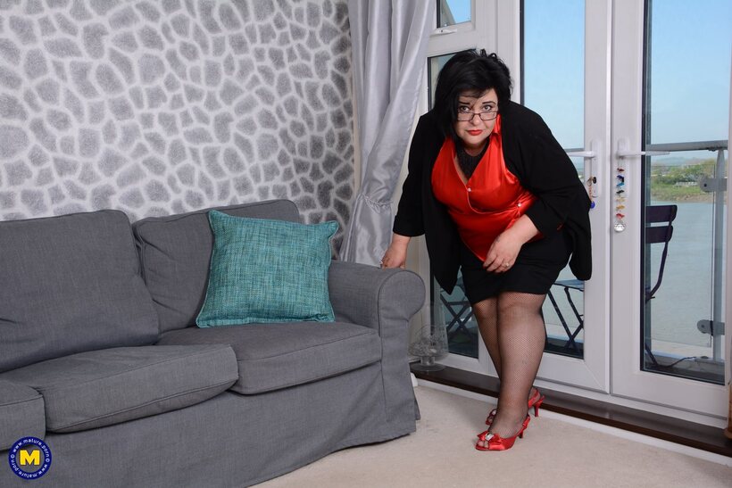 BBW nude photo 2 — Mature bbw strips to stockings and pumps her heavy tits up