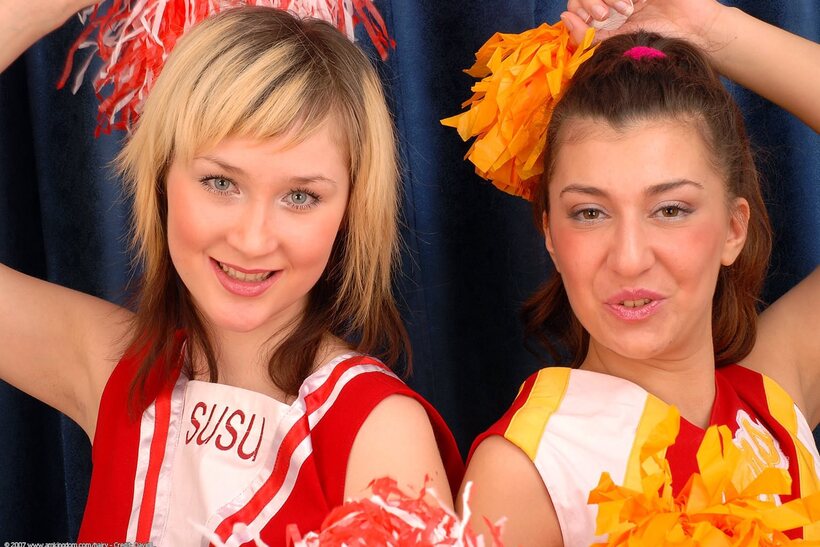 Photo 2 — Cheerleaders flash their pussies before a lesbian licking session