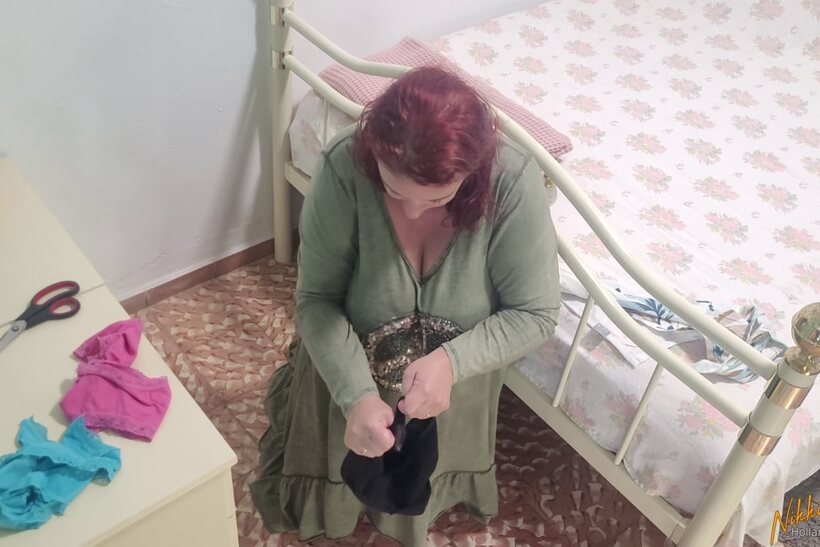 Nikki Holland blindfolds herself while toying with her panties in a dress (shot 7)