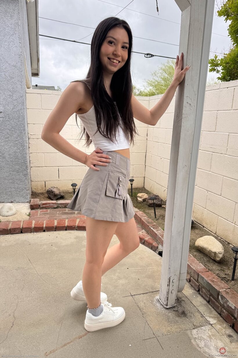 Photo 1 — Amber Angel slips off her shoes before getting fully naked