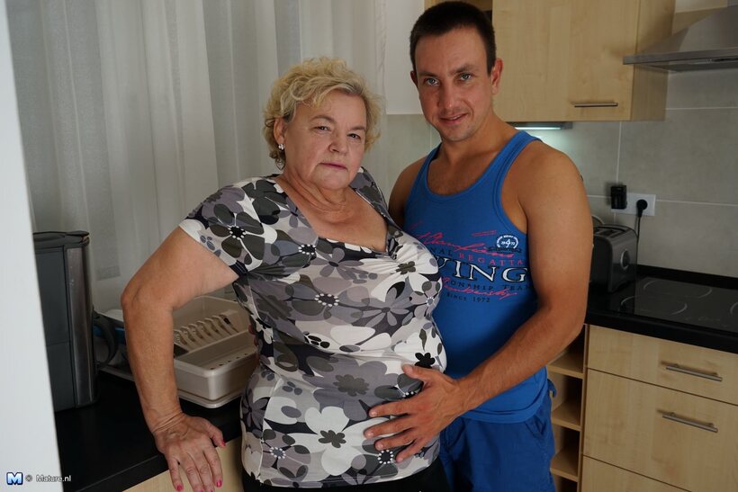 Sexy boy licks the old fatty’s saggy tits in the kitchen, photo 4 of 16