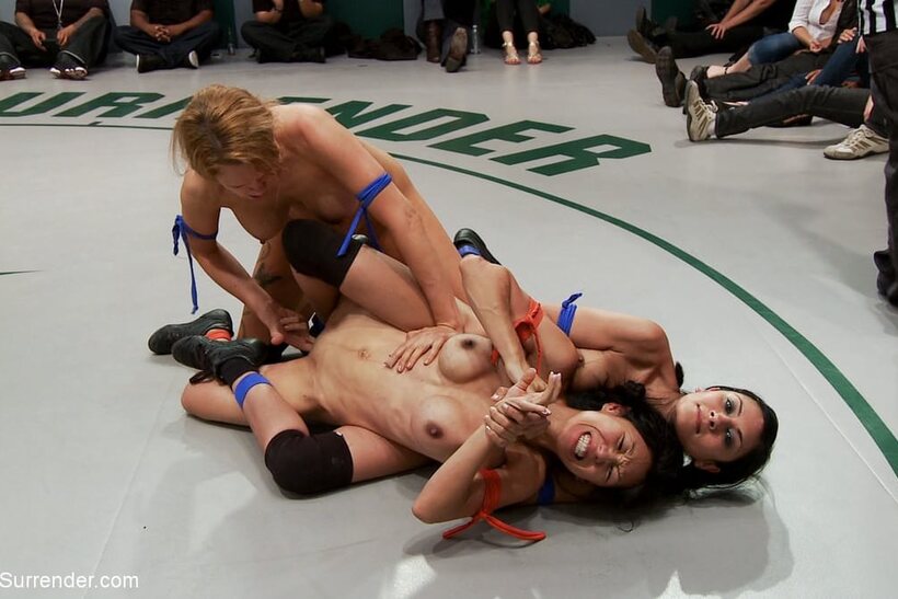 Image 4/21: Nude wrestlers pile up in a grappling match with Tia Ling and others
