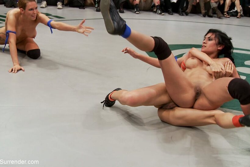 Photo 12 — Nude wrestlers pile up in a grappling match with Tia Ling and others
