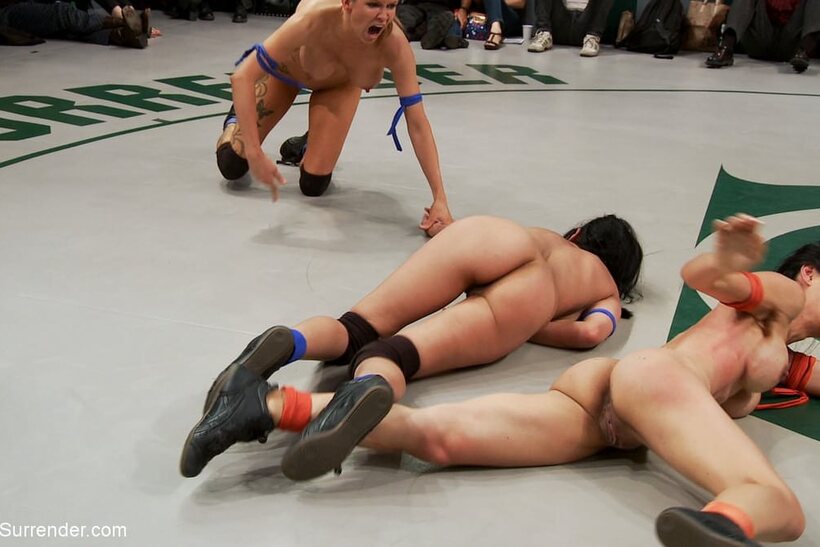 Nude wrestlers pile up in a grappling match with Tia Ling and others (shot 13)