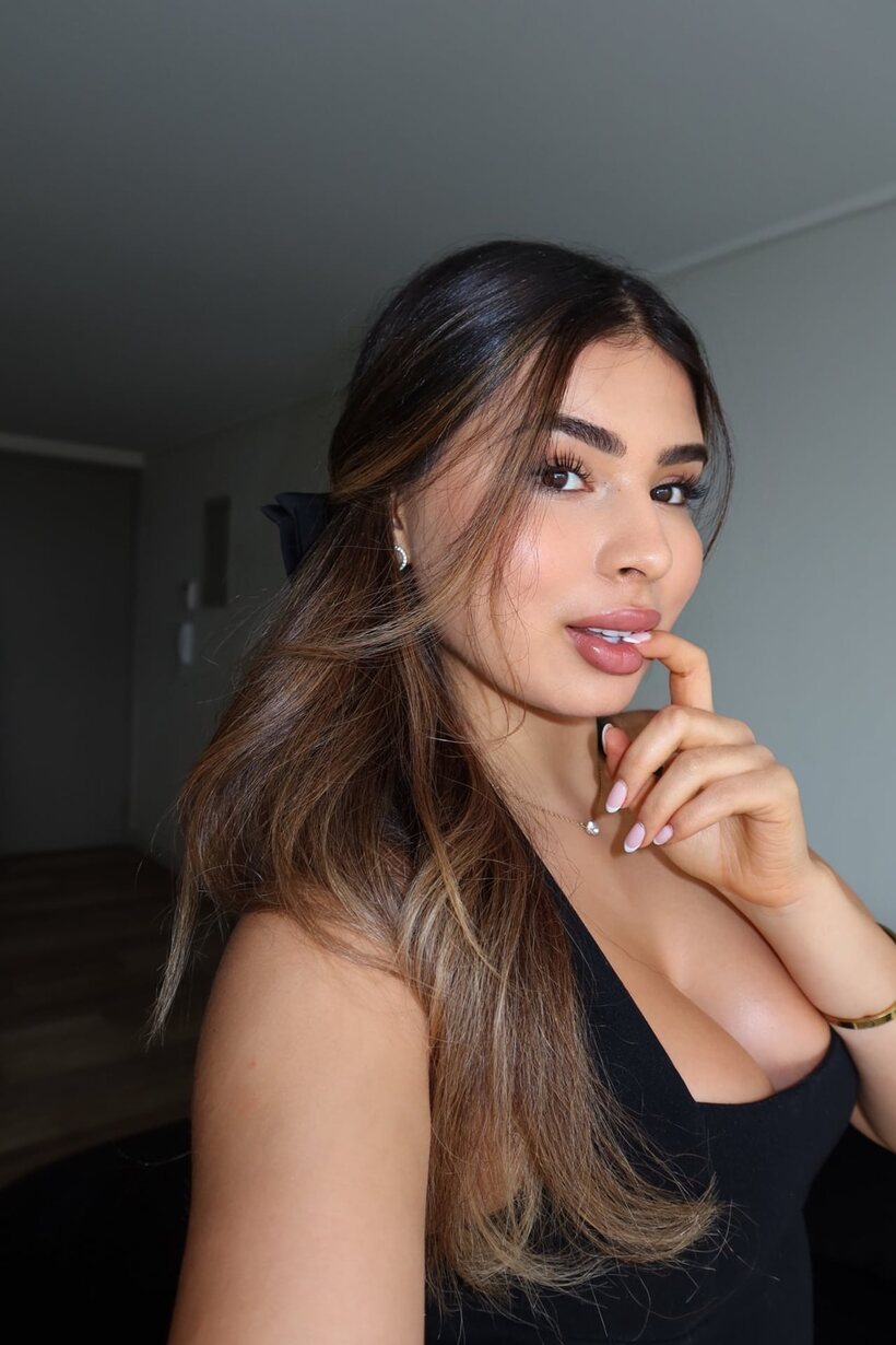 Image 13/16: Long-haired beauty snaps a selfie during her non nude pose