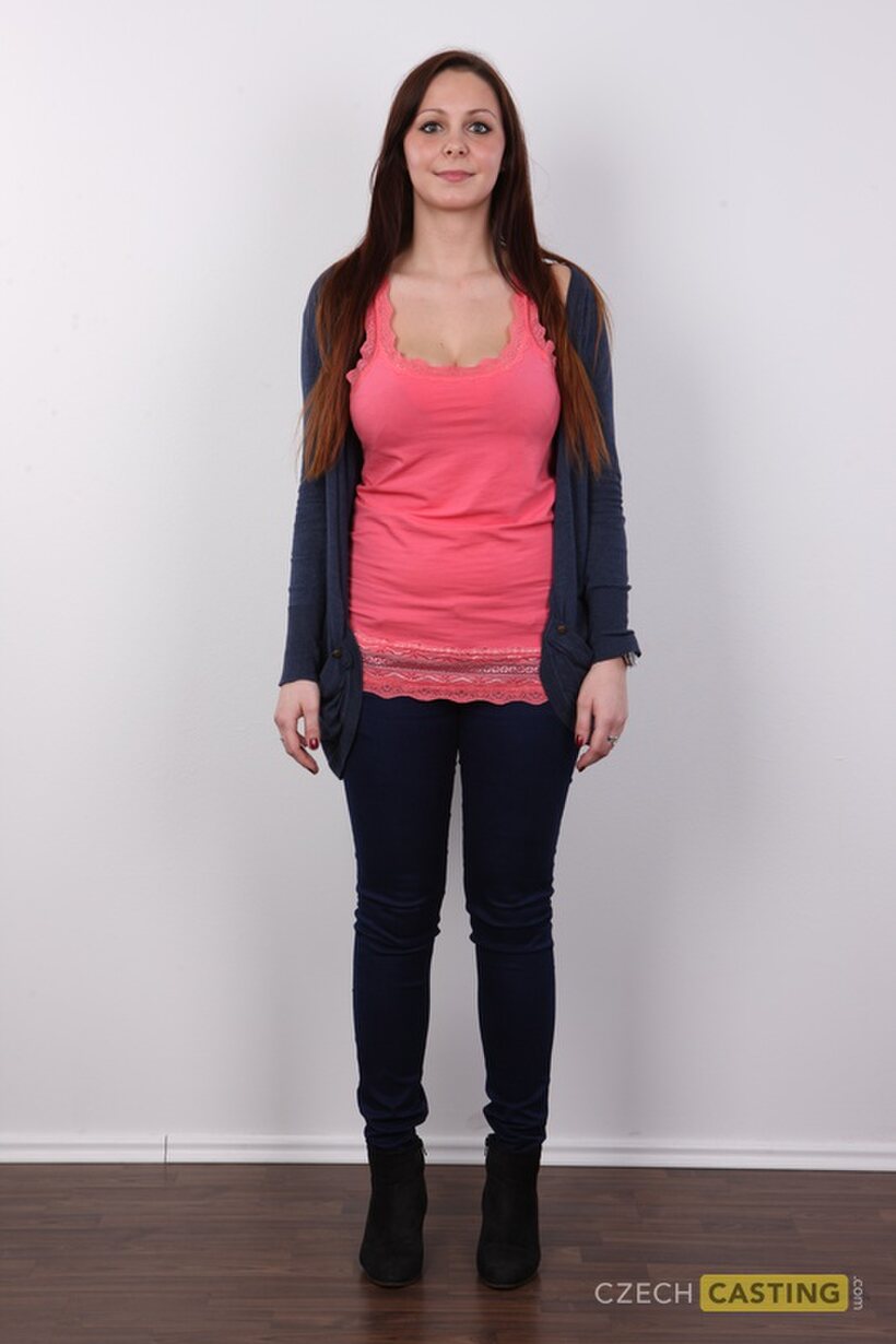 Photo 2 — Clothed brunette amateur slowly strips down after a casting session