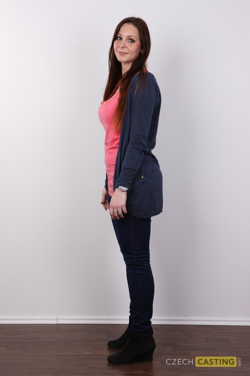 Clothed brunette amateur slowly strips down after a casting session (shot 3)