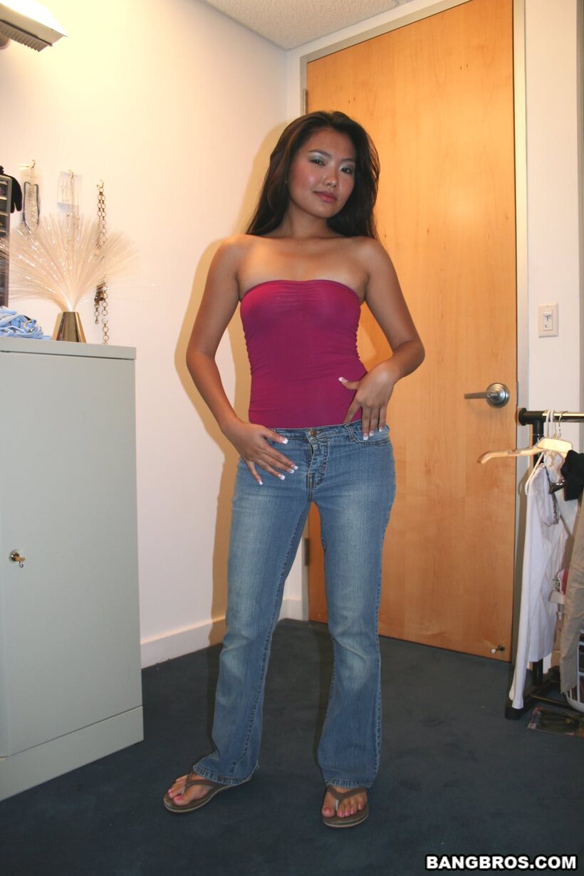 Photo 1 — Pornstar Donny Long strips out of her jeans and shows her legs