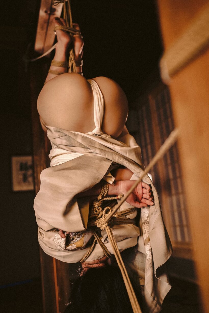 Asian pic 7 from the set «Bound upside down, an Asian babe teases her big booty»