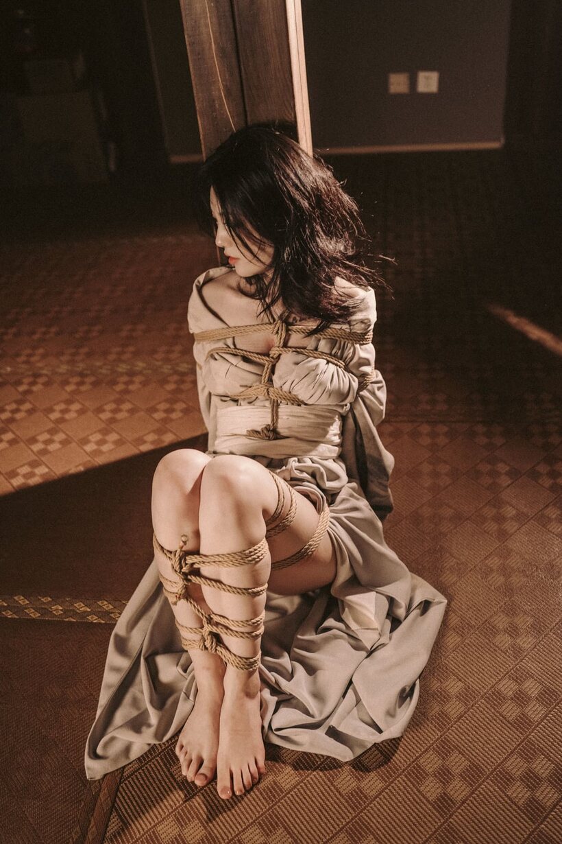 Bound upside down, an Asian babe teases her big booty, photo 10 of 10
