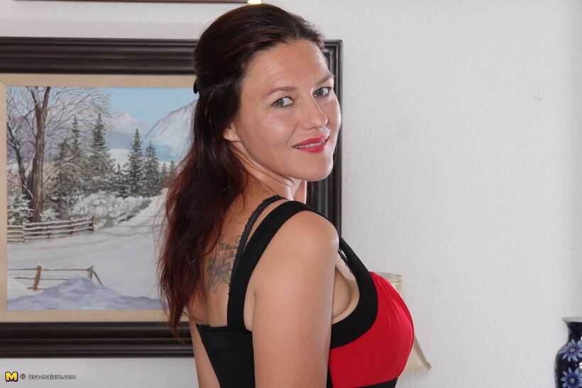 Photo 4 — Joana Jakes undresses and reveals her hairy pussy to the camera