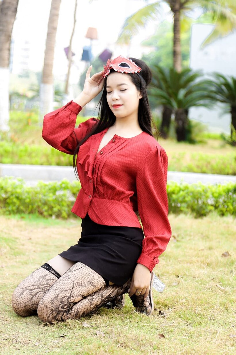 Photo 2 — Outside in stockings and heels, masked Asian beauty strikes a pose