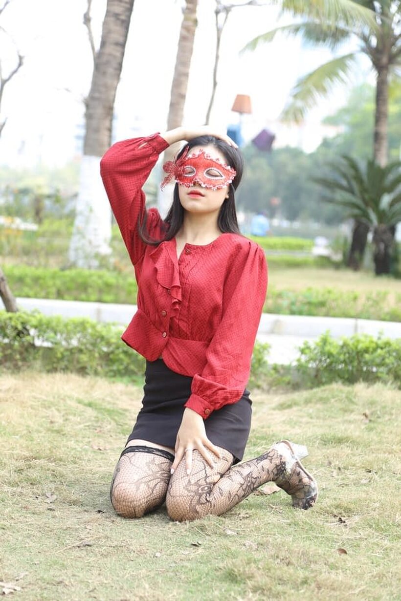 Photo 8 — Outside in stockings and heels, masked Asian beauty strikes a pose