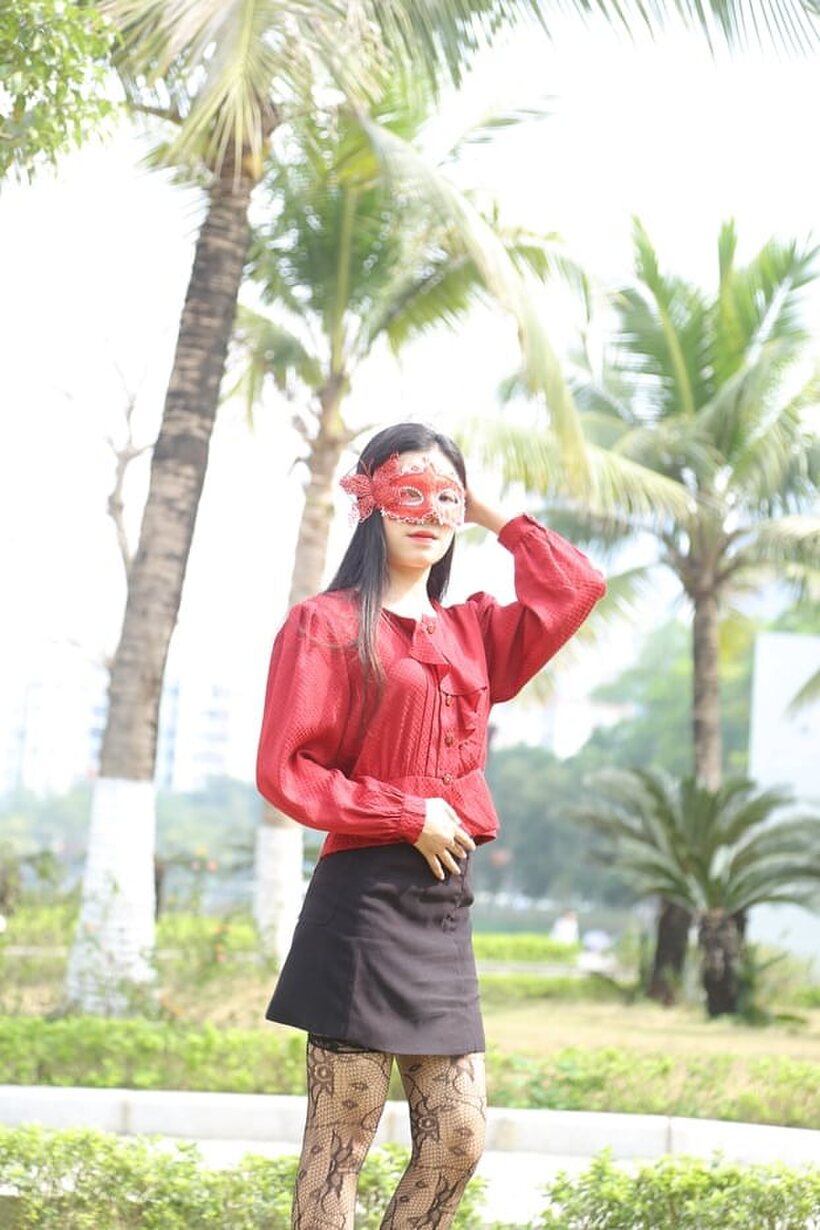 Image 10/21: Outside in stockings and heels, masked Asian beauty strikes a pose