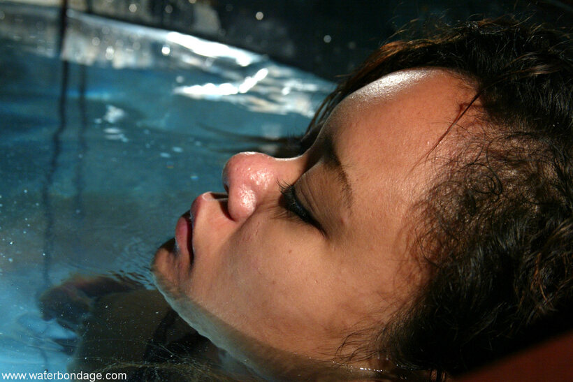 Photo 4 — Annie Cruz strokes her pussy in a wet BDSM solo scene
