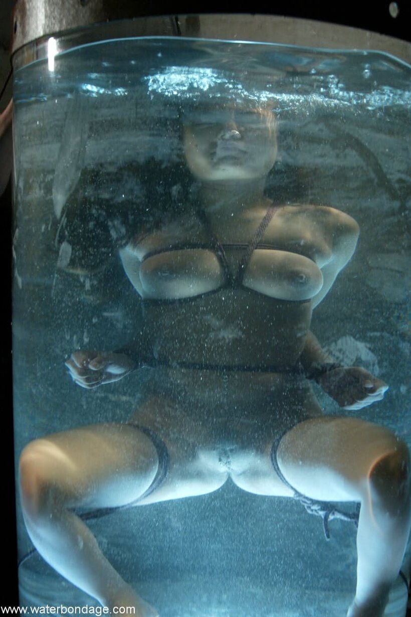 Photo 6 — Annie Cruz strokes her pussy in a wet BDSM solo scene