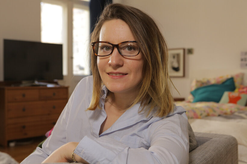 Image 20/21: German amateur sits naked cross-legged on the bed, then dresses