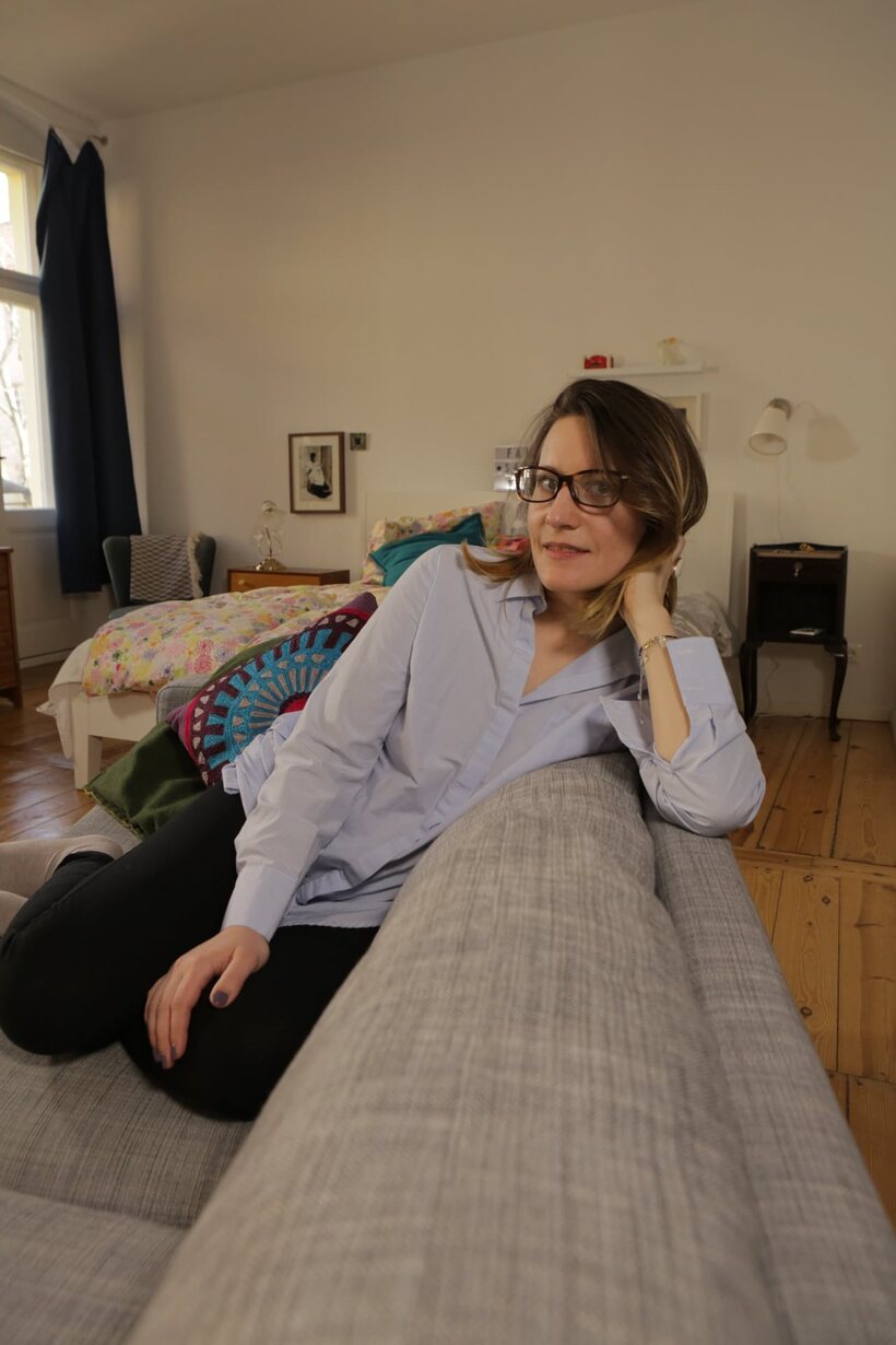 Amateur pic 21 from the set «German amateur sits naked cross-legged on the bed, then dresses»