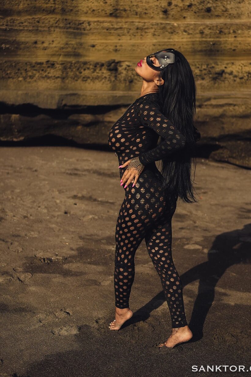 Image 8/20: Japanese girl shows off her big round tits on the beach
