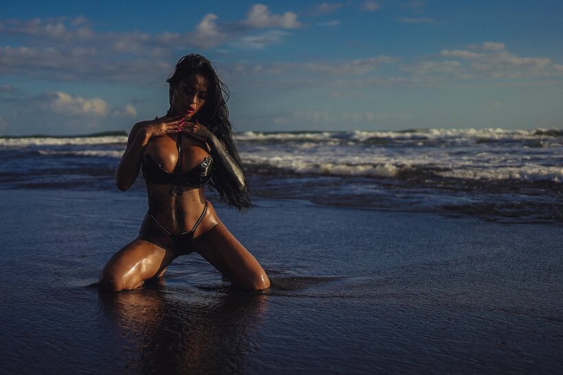 Photo 11 — Japanese girl shows off her big round tits on the beach