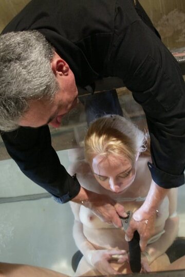 Wet Annette Schwarz plays with a dildo and shows her natural tits and pussy