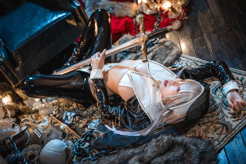 Photo 3 — Sexy girl poses with her big tits on display in cosplay lingerie