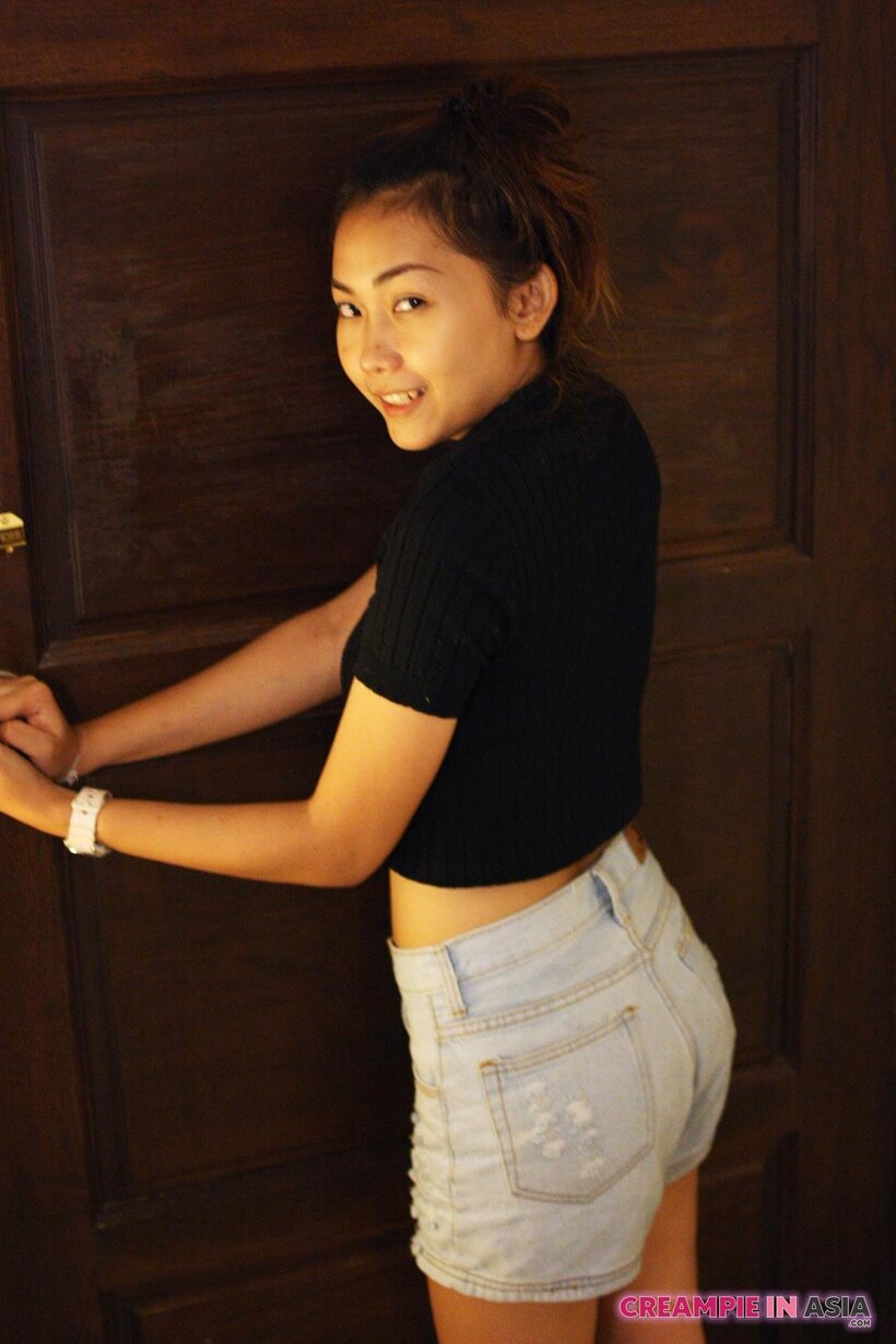 Petite girl flaunts her small tits while teasing (shot 4)