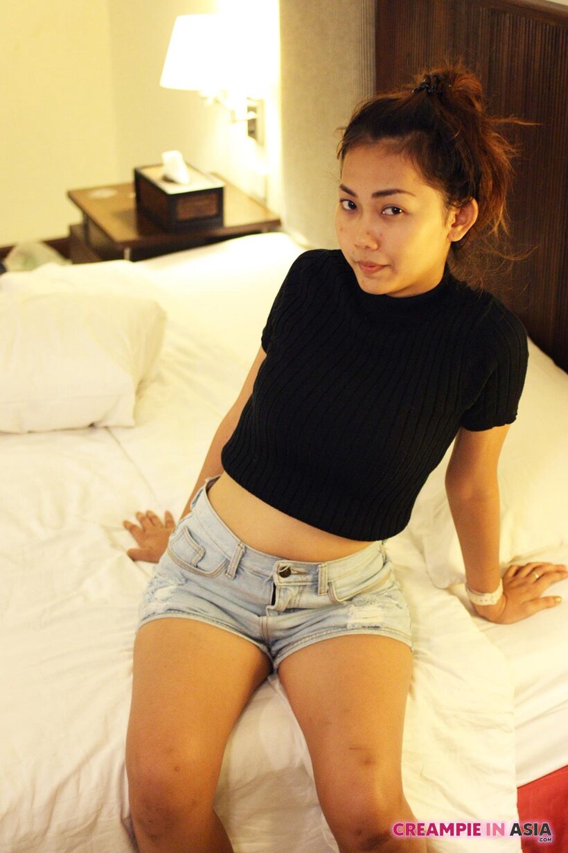 Petite girl flaunts her small tits while teasing, photo 8 of 16