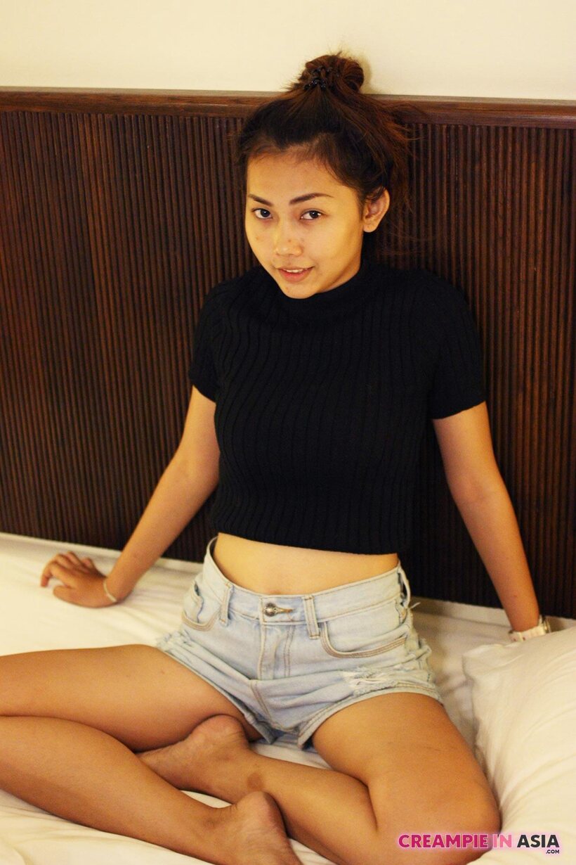 Photo 10 — Petite girl flaunts her small tits while teasing