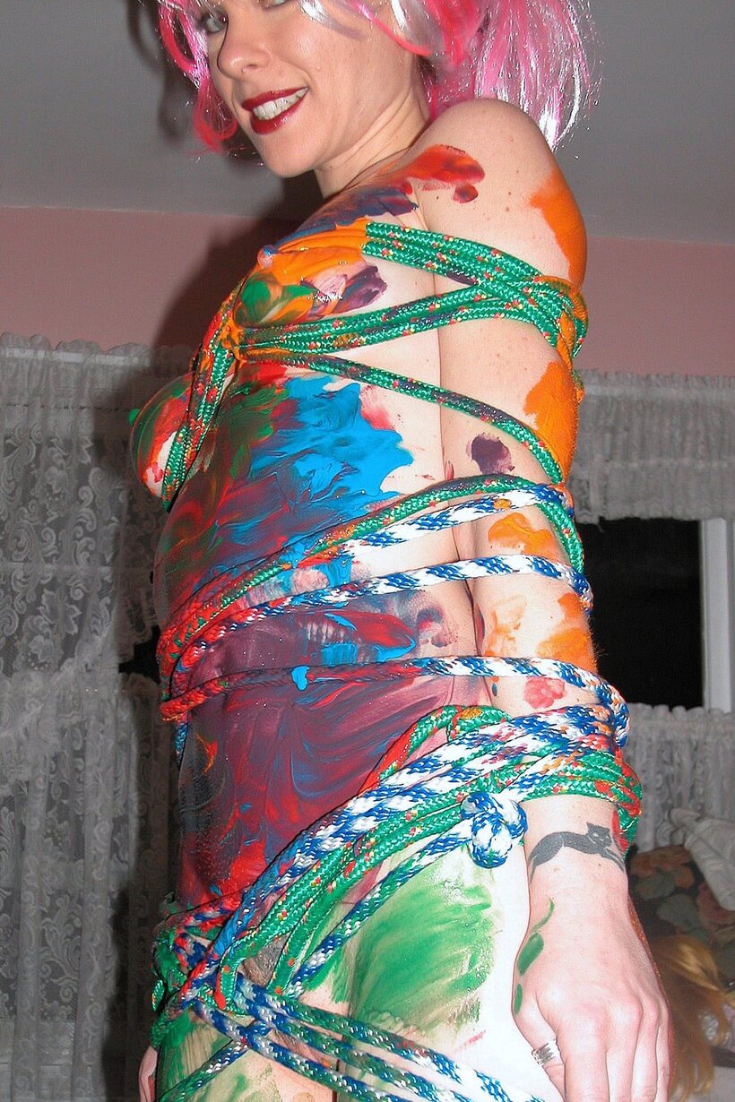 Photo 9 — Michelle Brookes gets tied down and soaked with body paint in the bath