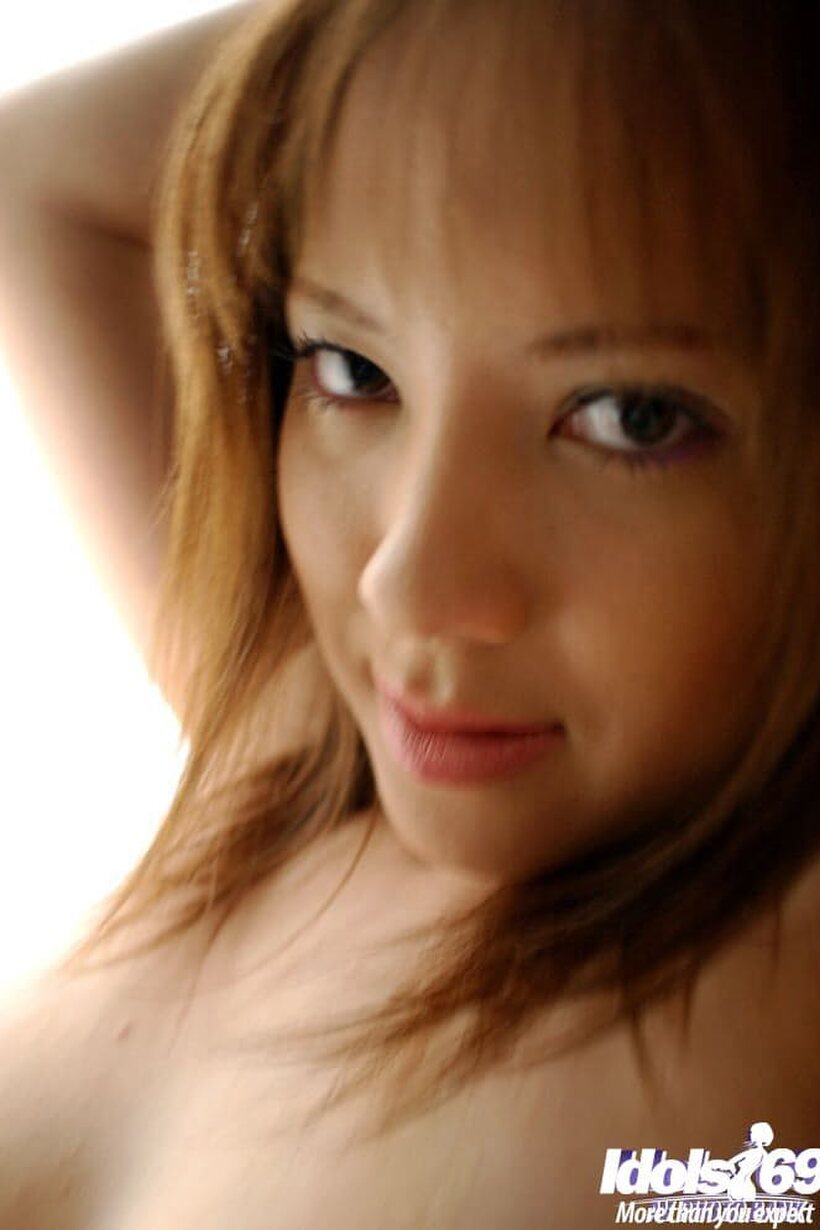Japanese girl in panties shows her big tits (shot 11)