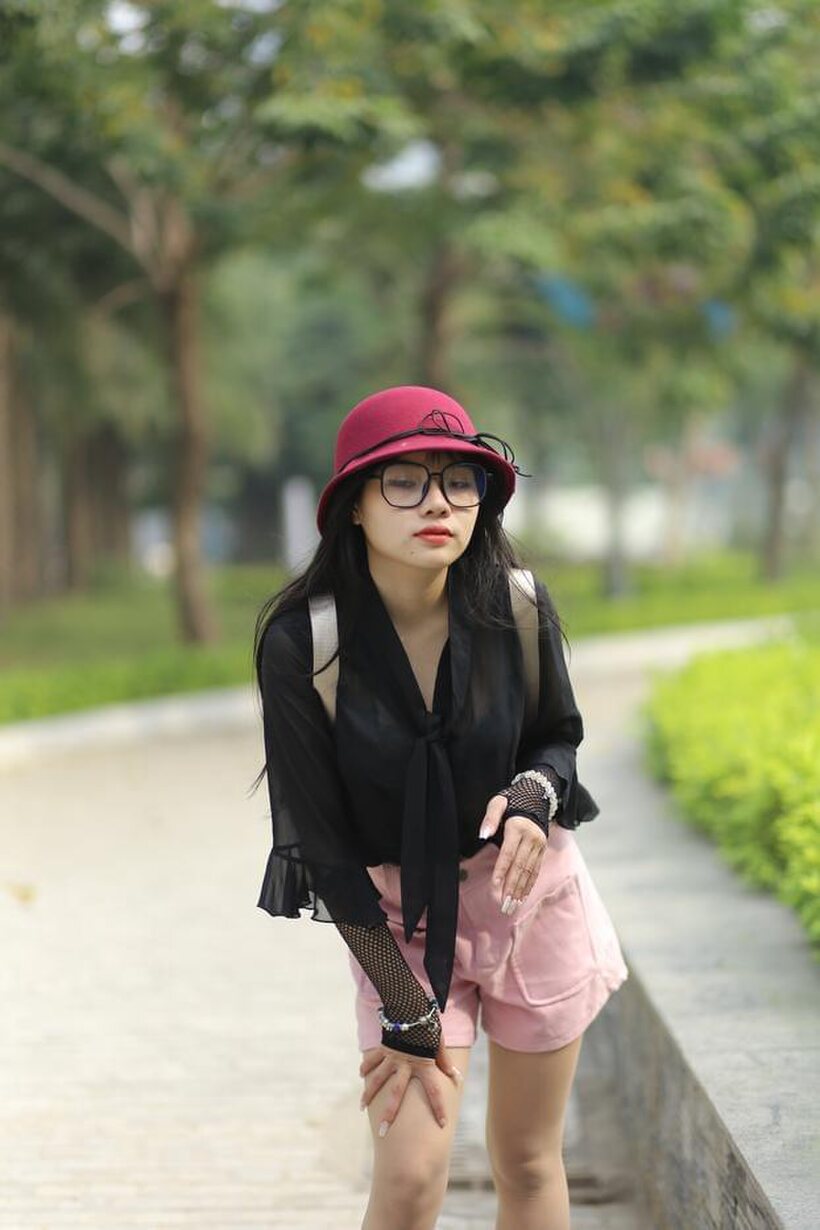 Image 21/21: Asian girl strips out of her shorts and poses naked